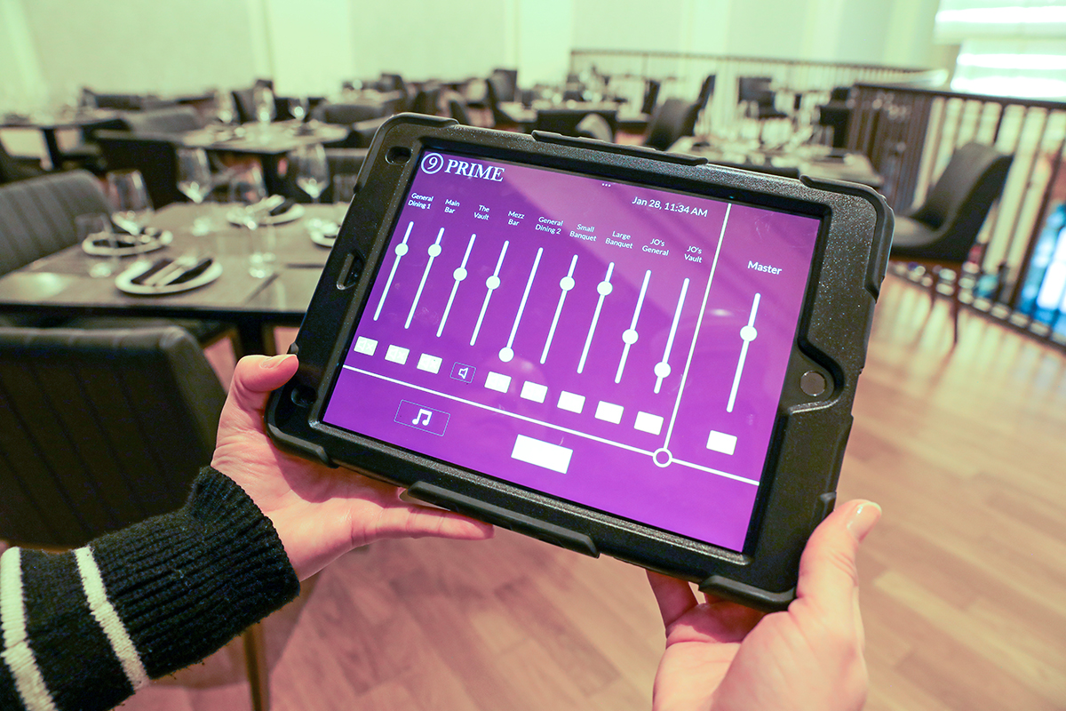 Tablet showing media controls for 9 Prime restaurant audio system