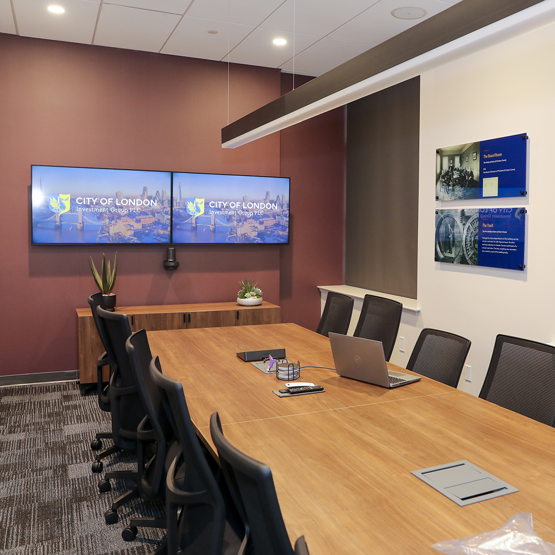 City of London conference room with dual television screens