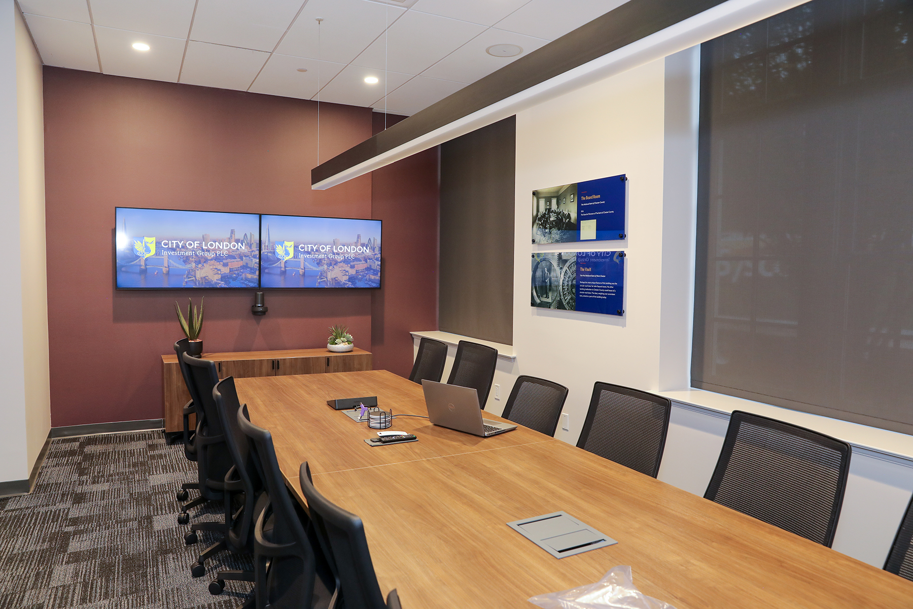 City of London conference room with dual television screens