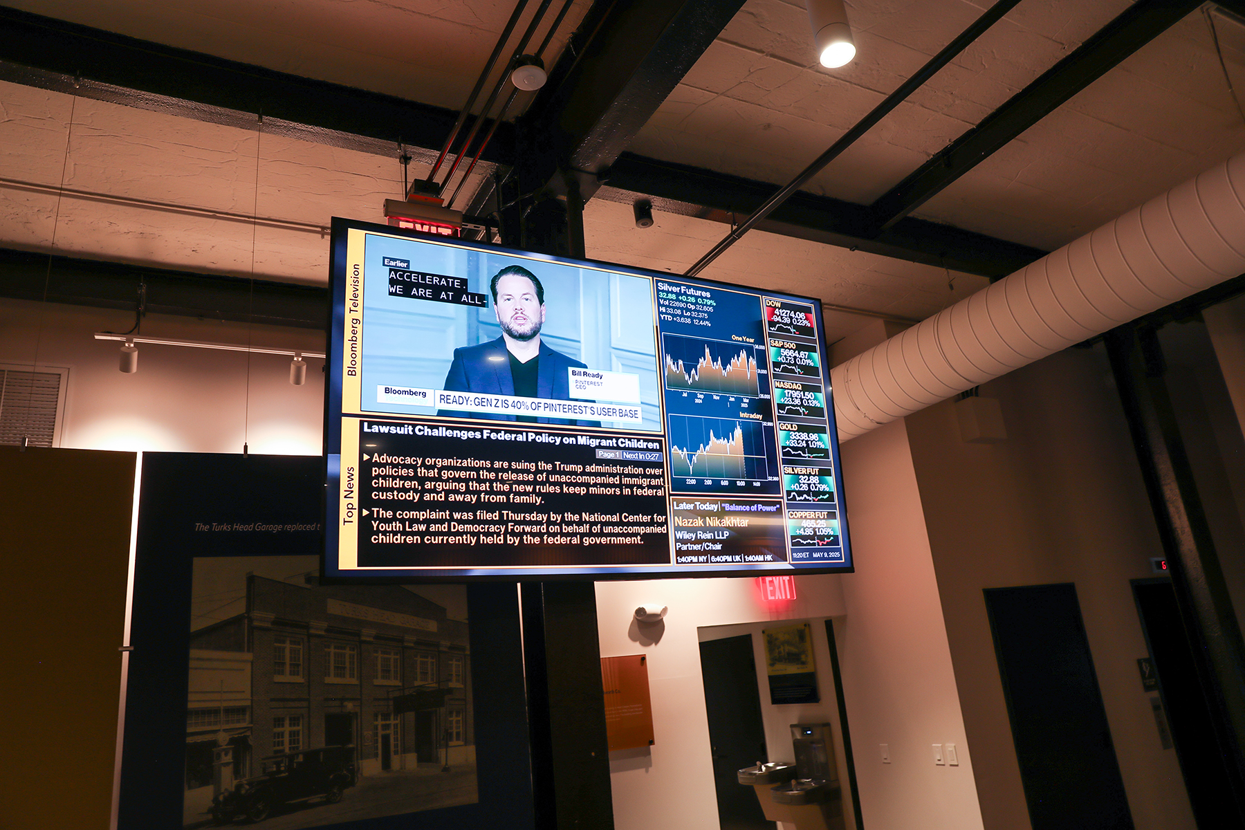 Ceiling mounted television showing a news channel