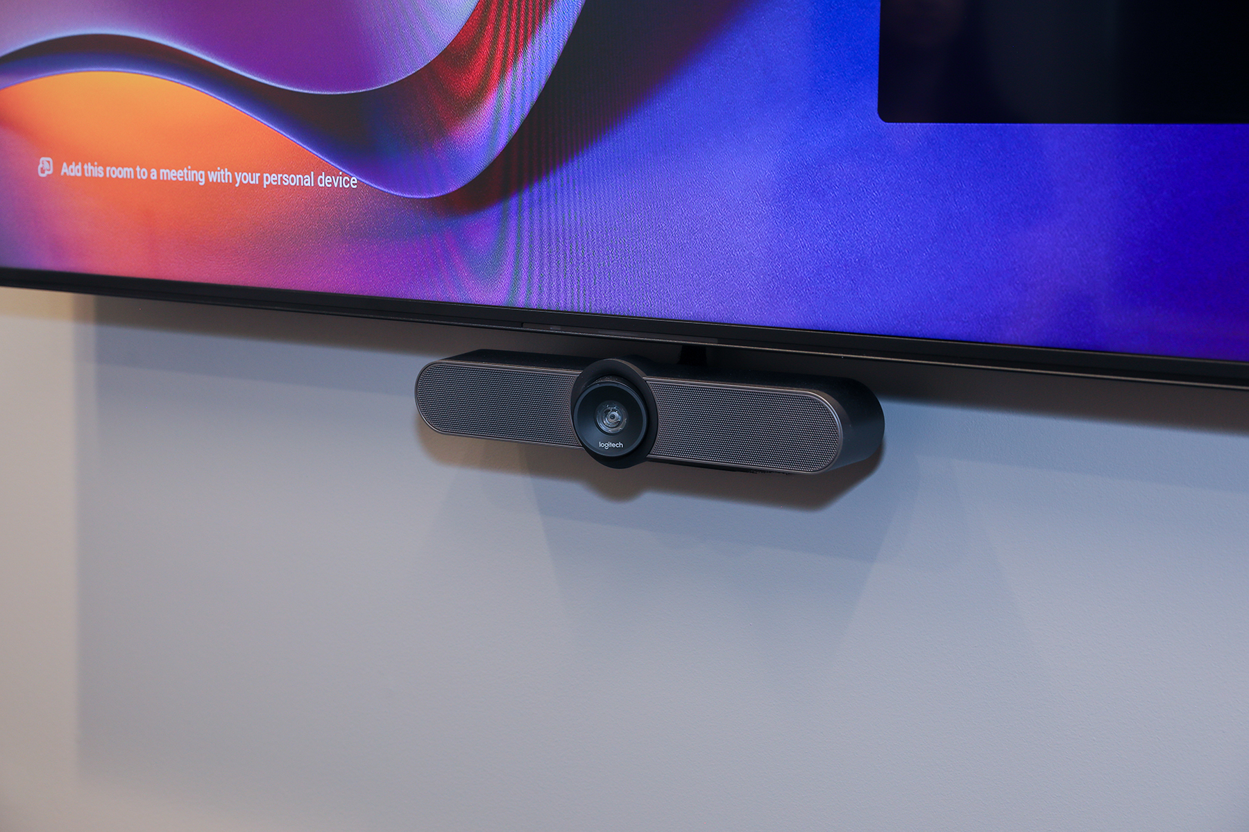 Logitech camera mounted underneath TV screen