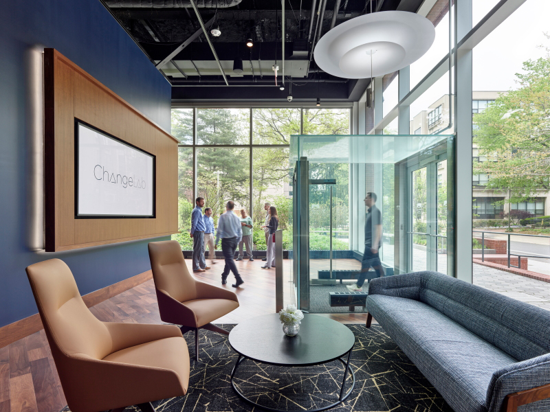 ChangeLab lounge area featuring video wall